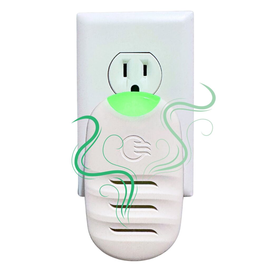 A Wilro Personal Waterless Vaporizer with a white plug and green indicator light is plugged into a wall outlet, releasing gentle fragrance illustrated by green wavy lines as it scents the air.